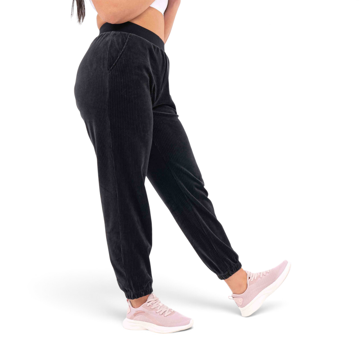 FRG black knit track pants with a regular fit, elasticated waistband, and ribbed texture worn by a model
