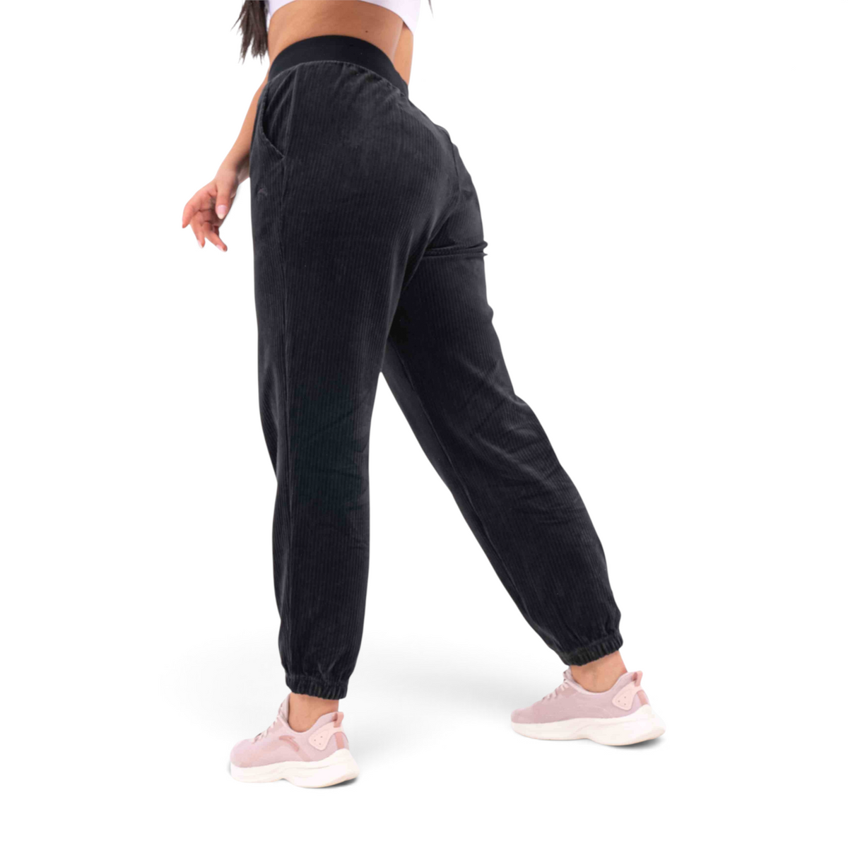 FRG black corduroy knit track pants with a regular fit, elastic waistband, and cuffed ankles worn by a model.