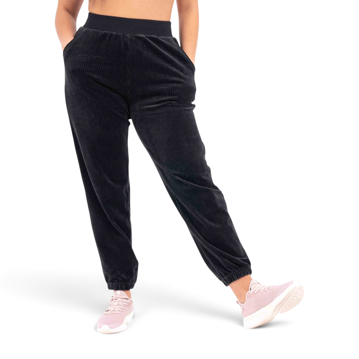 FRG black corduroy knit track pants with a regular fit, elastic waistband, and cuffed ankles on a model