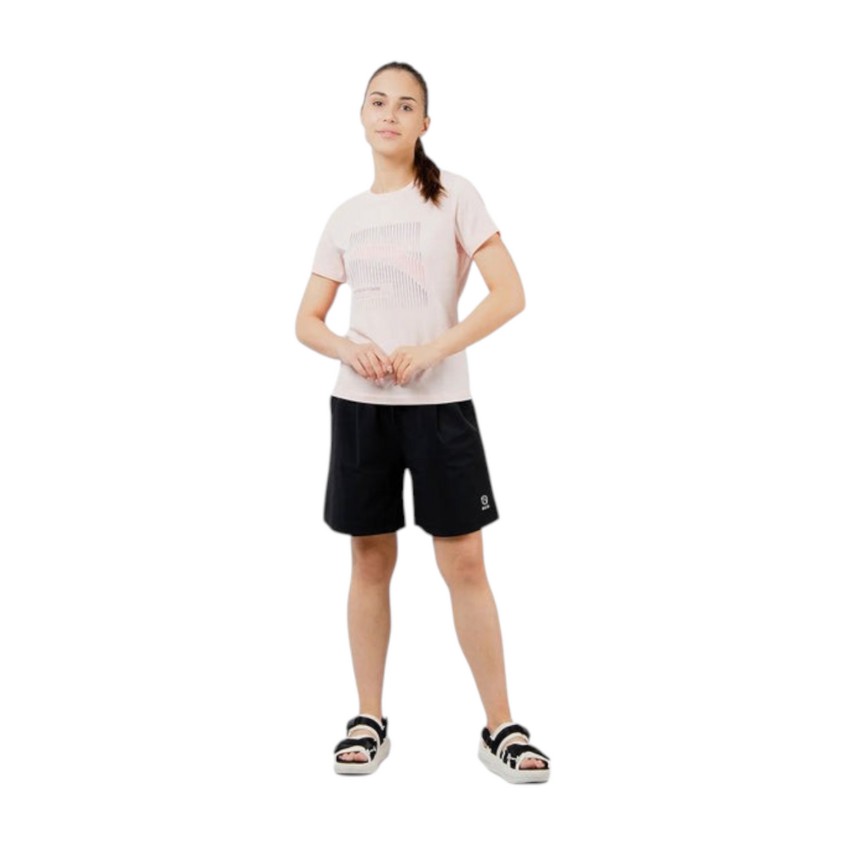 FRG model wearing an ANTA fog rose pink cotton-blend short sleeve training t-shirt with black shorts and sandals