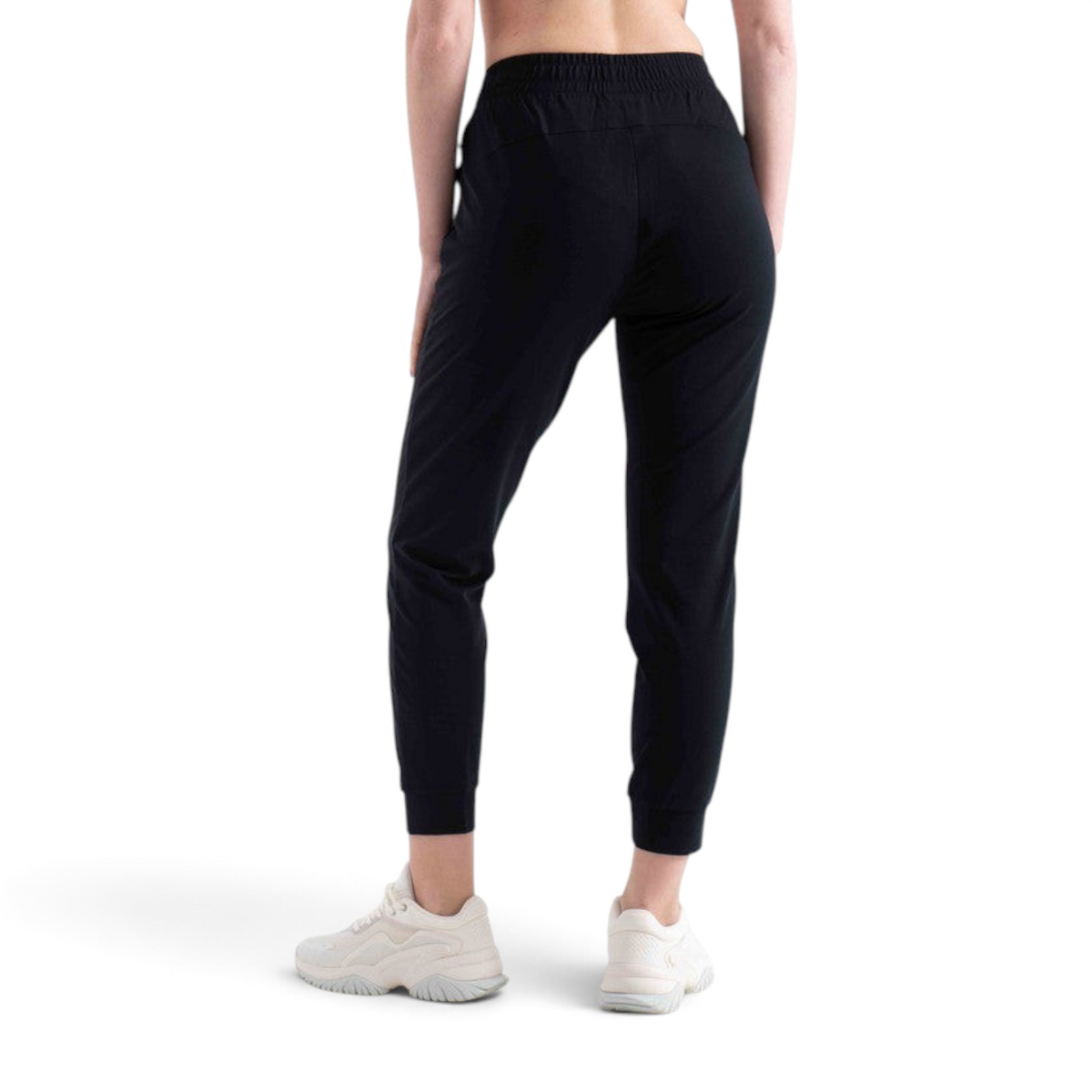 FRG knit ankle pants in black with an elasticated waistband and cuffed hems, worn by a model from the back view.