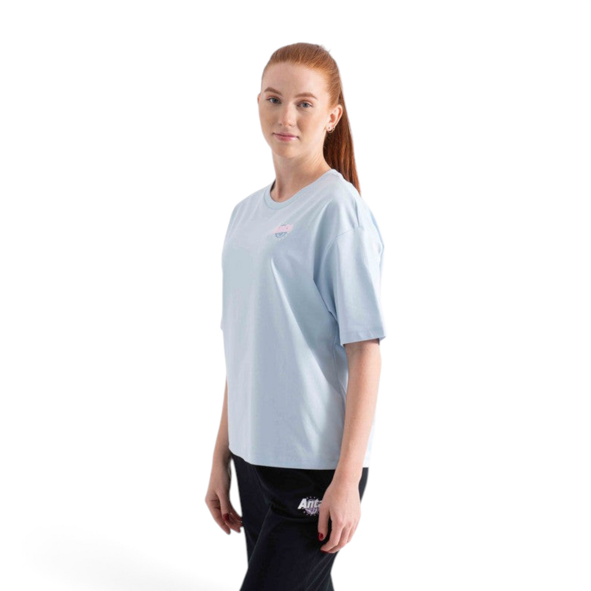 FRG light blue short sleeve t-shirt worn by a woman with red hair against a white background