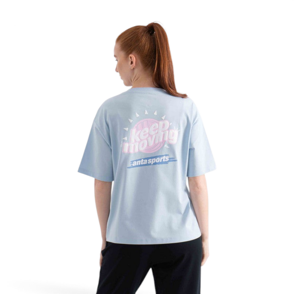 FRG light blue short sleeve t-shirt with Keep Moving graphic print on the back worn by a woman
