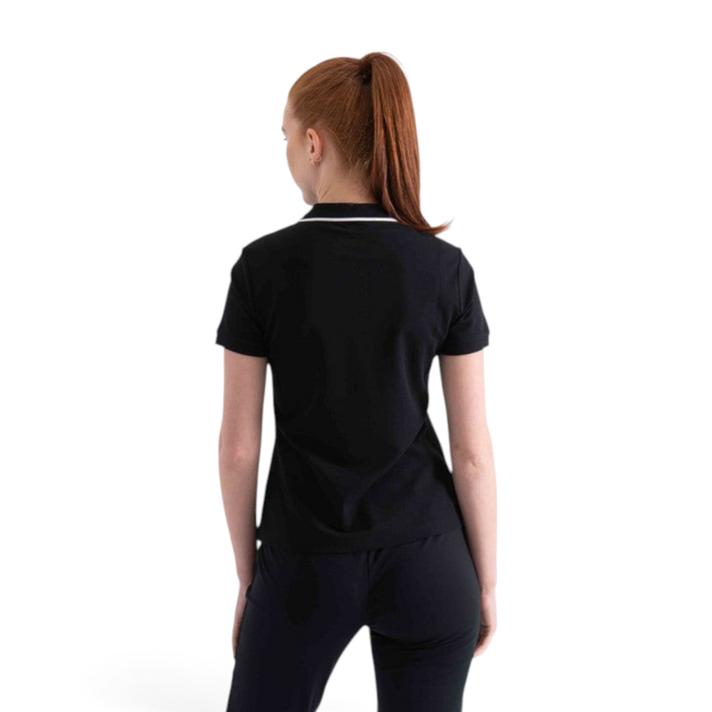 Back view of a woman wearing a black FRG SS POLO shirt with white collar trim against a white background.