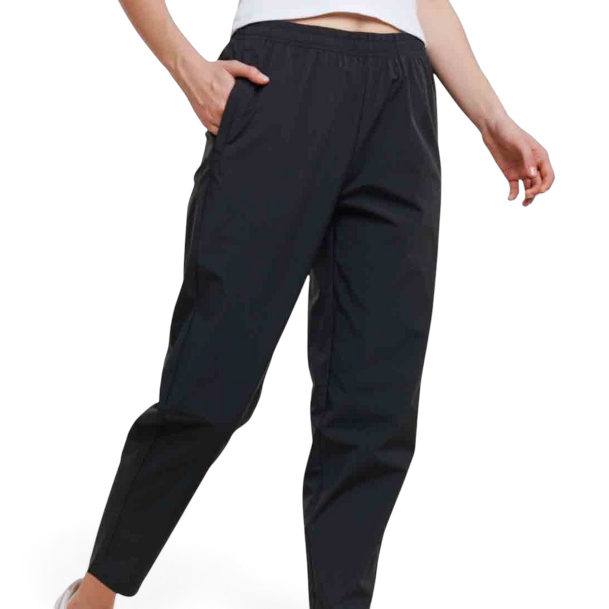 FRG black ankle pants with an elastic waistband and side pockets worn by a model against a plain background