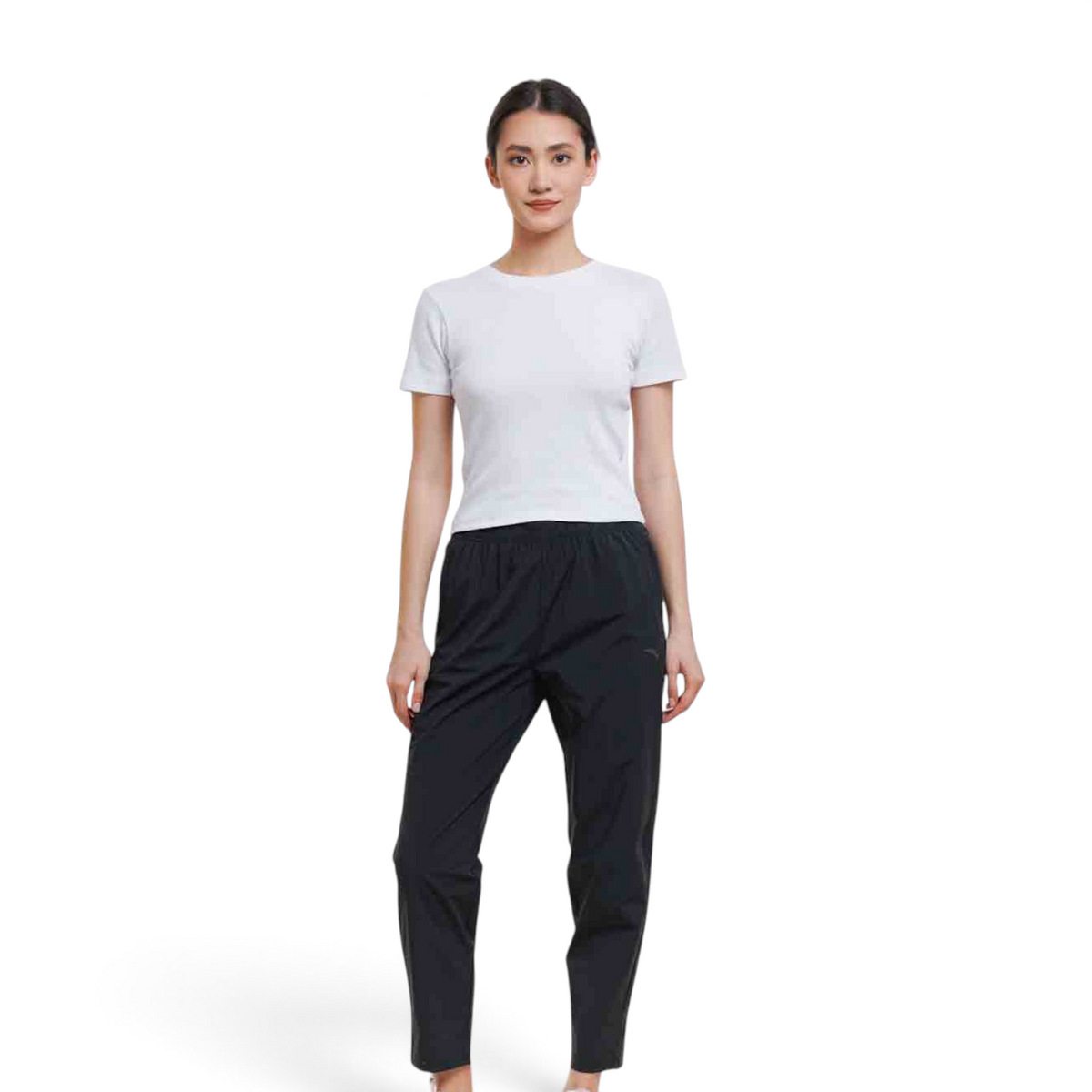 Model wearing FRG black ankle pants with a white t-shirt, featuring a comfortable elastic waistband