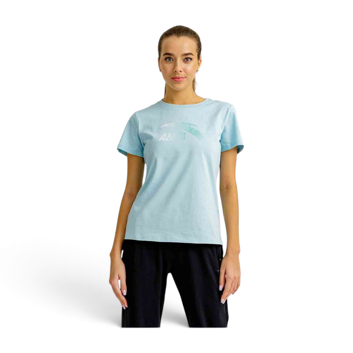A model wearing a light blue FRG short sleeve t-shirt with a graphic logo print, styled with black trousers.