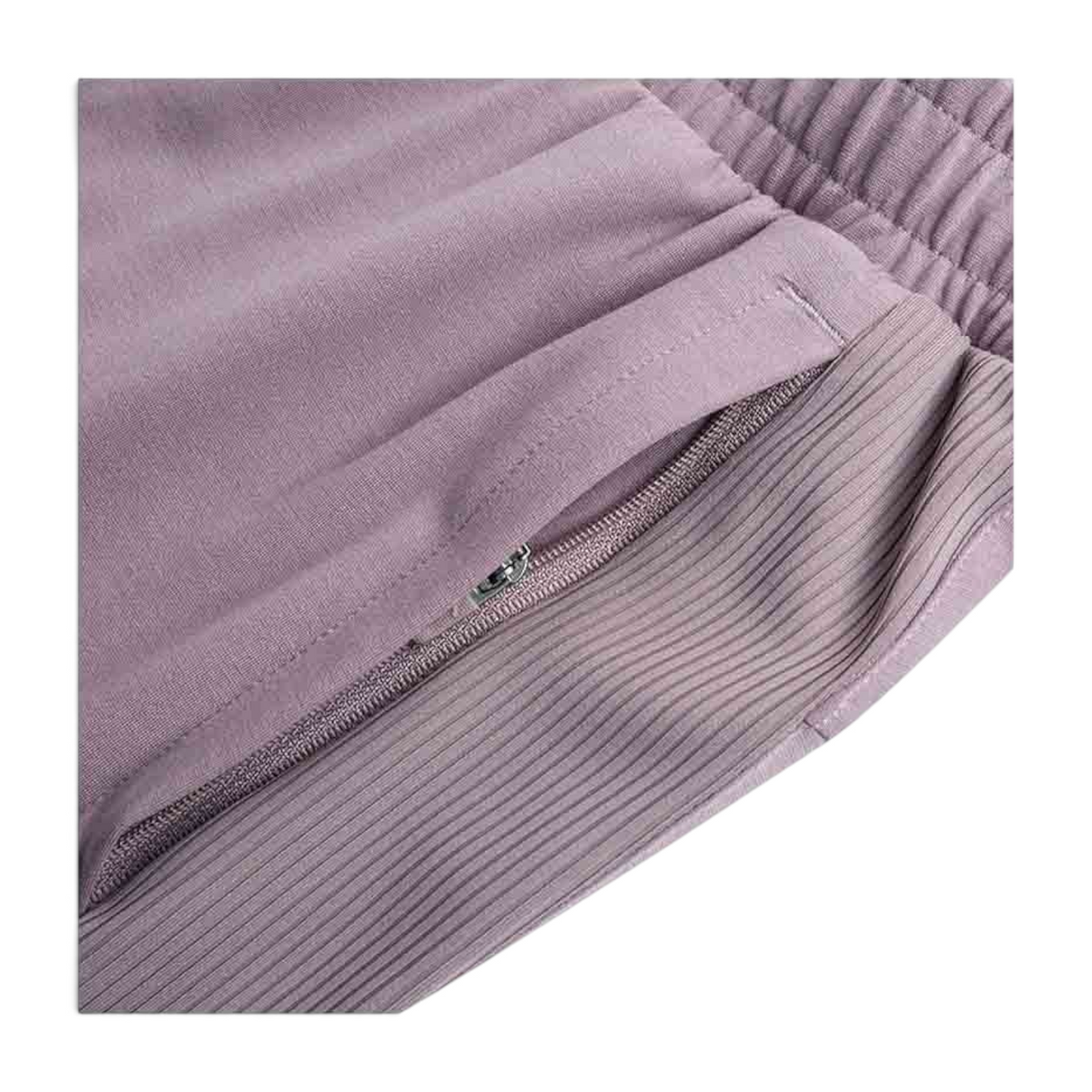 FRG knit ankle pants in mauve featuring a zippered side pocket and ribbed side panel detail.