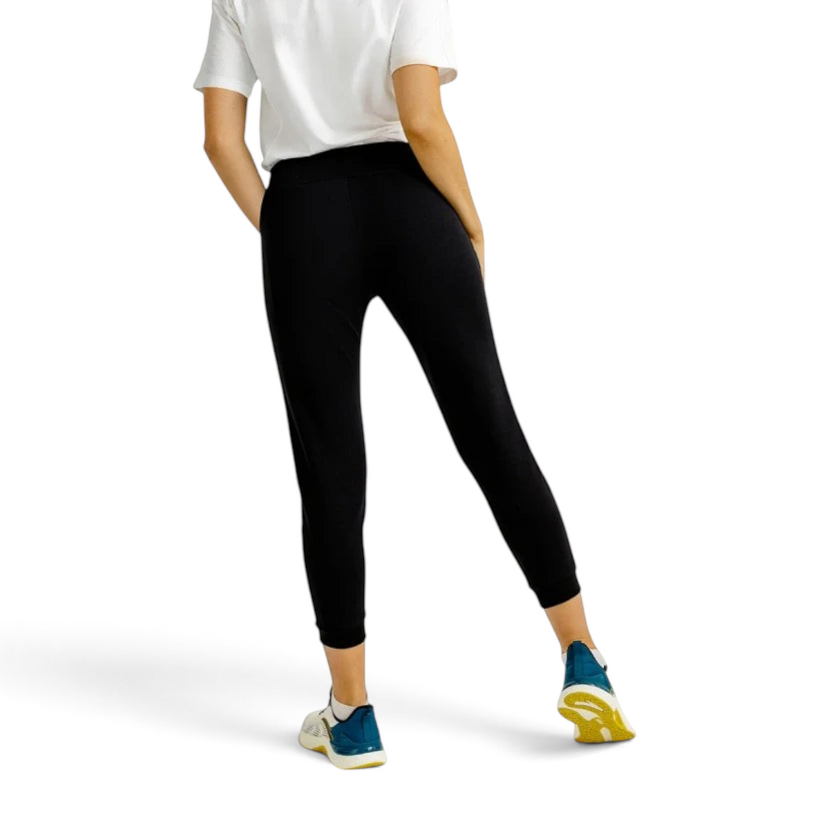 FRG ANTA A-Sports Shape black knit ankle pants worn by a model with white t-shirt and athletic sneakers, back view