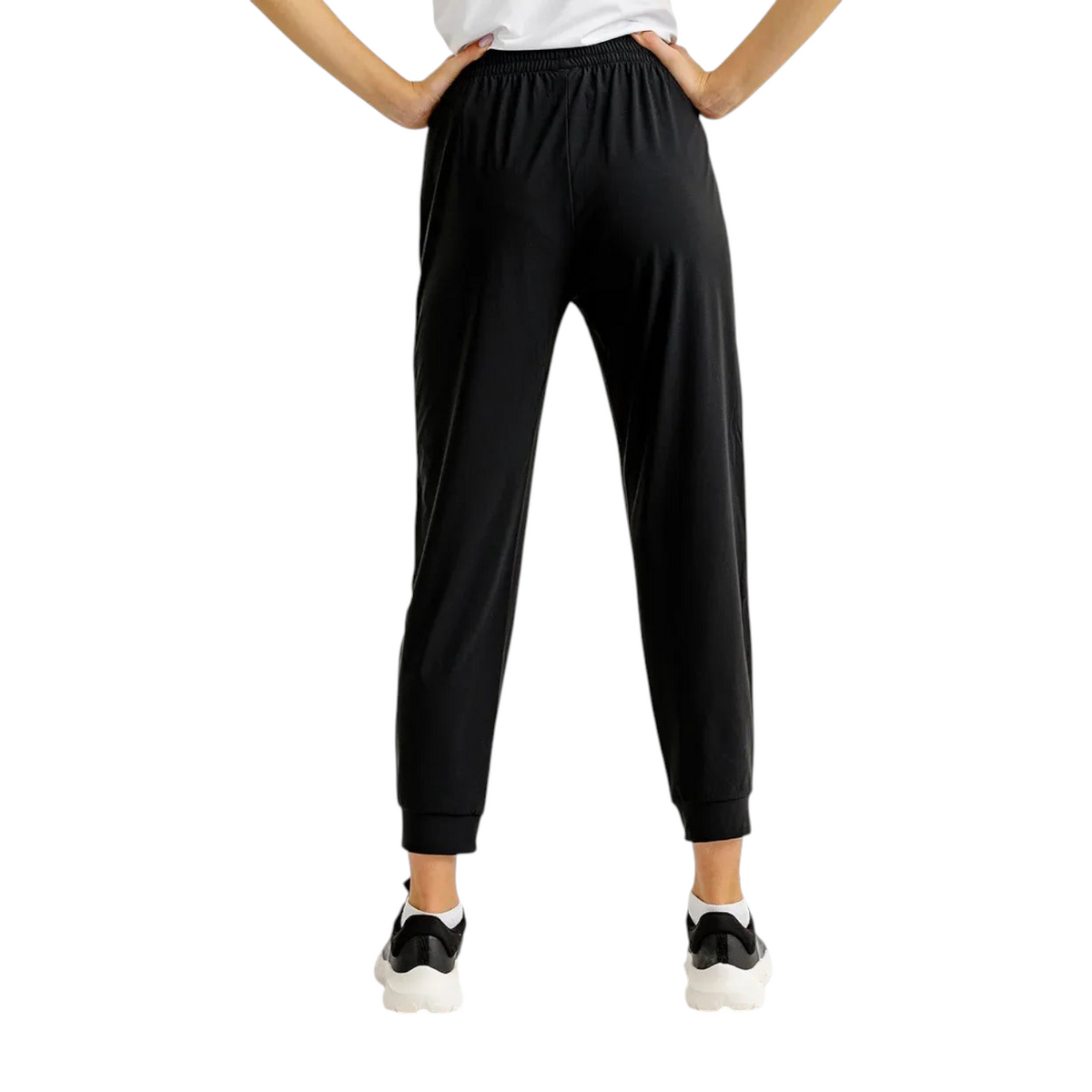 FRG black knit ankle pants featuring a comfortable elastic waistband and cuffed hems, shown from the back view.