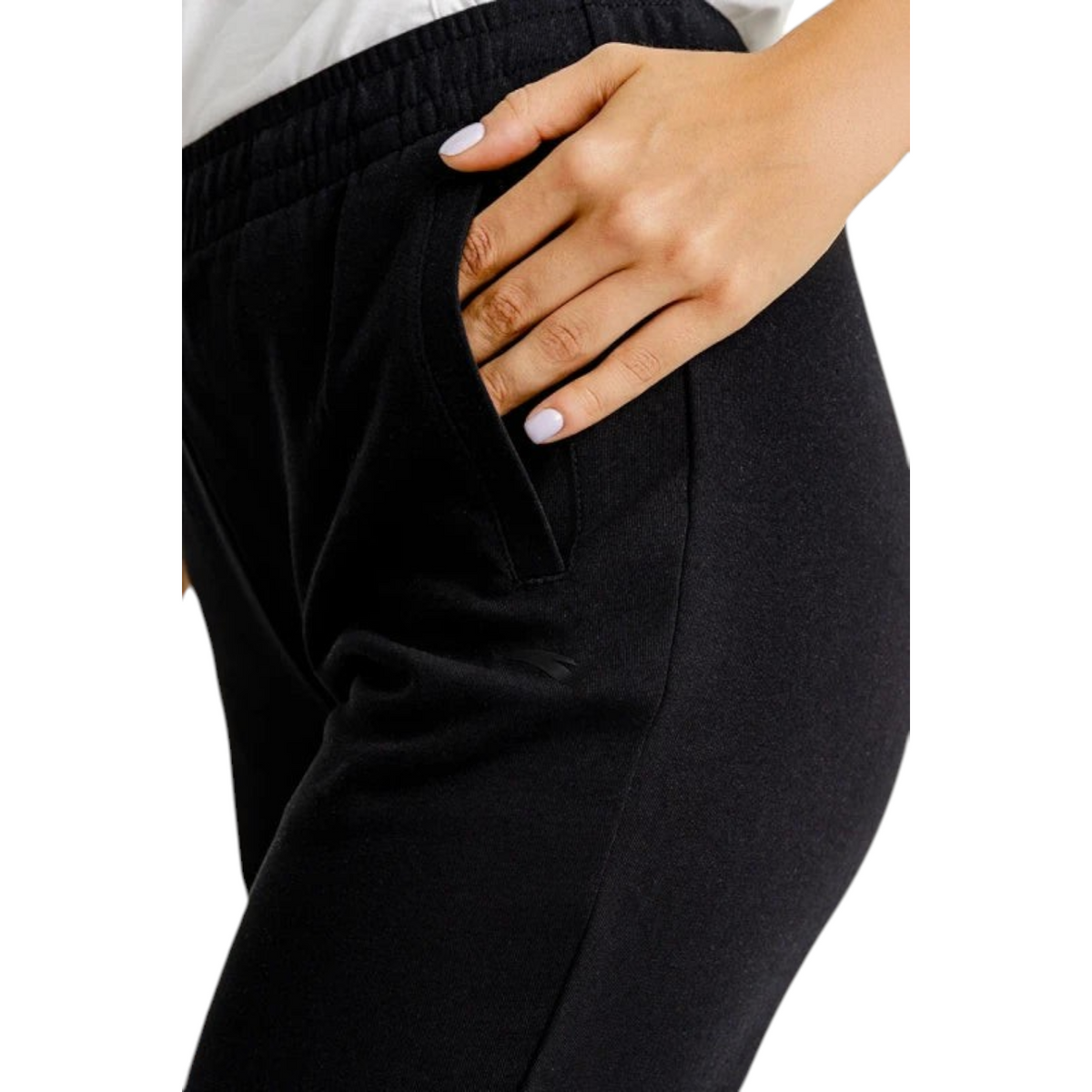 FRG Anta black knit cross training pants with elastic waist and zippered side pocket on a person