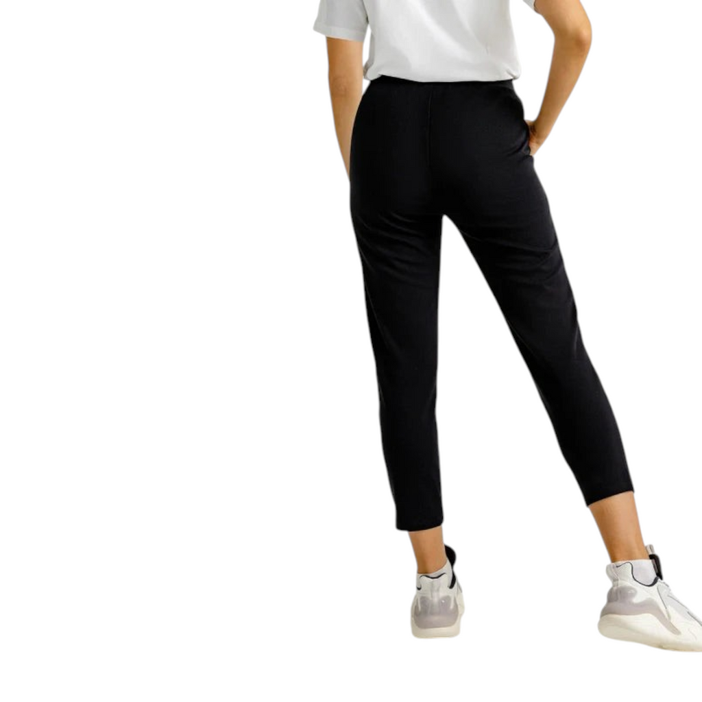 FRG Anta black straight-leg knit cross training pants with elastic waist and zippered pockets, back view