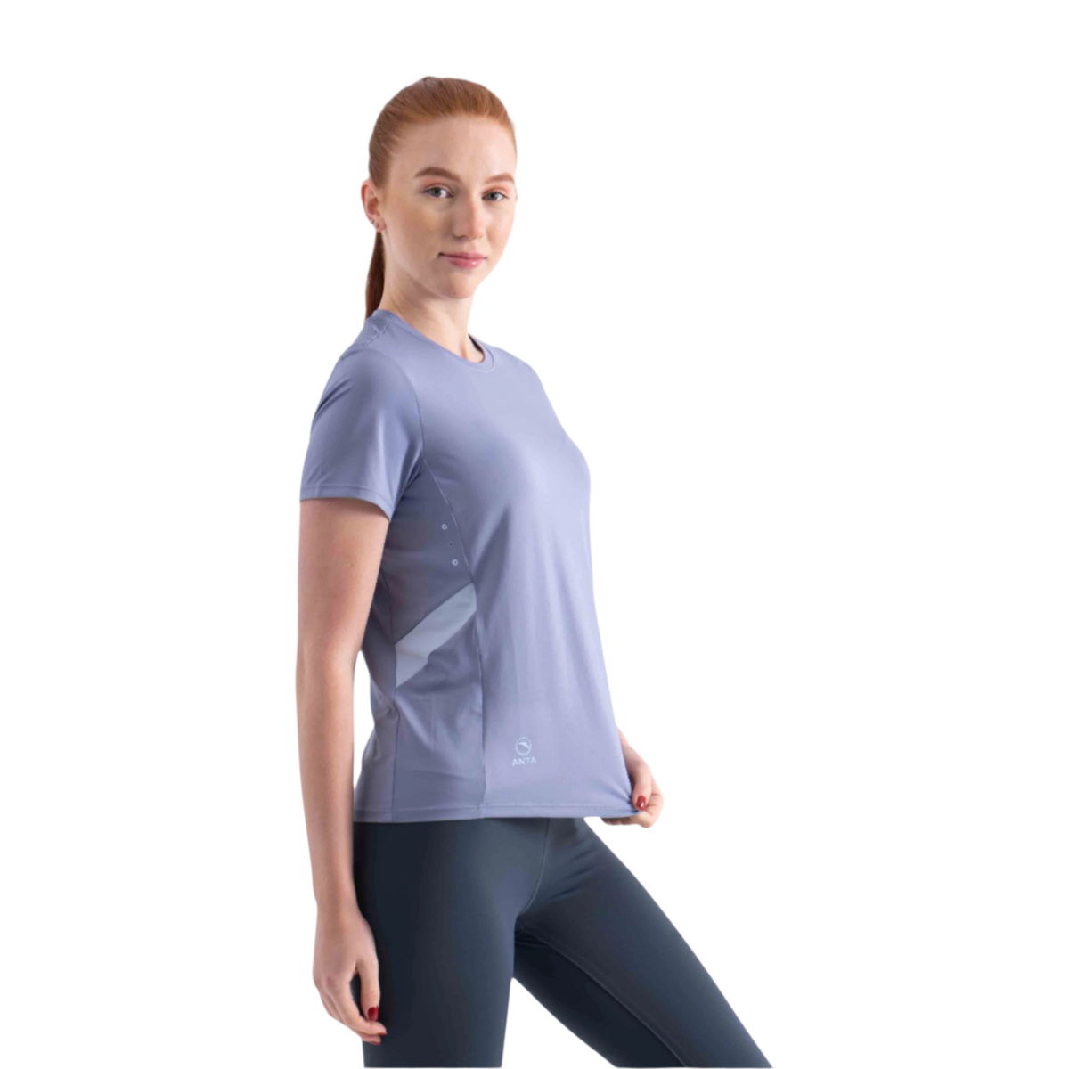 A woman wearing a FRG light purple short-sleeve athletic t-shirt with side panel detailing, isolated on white.