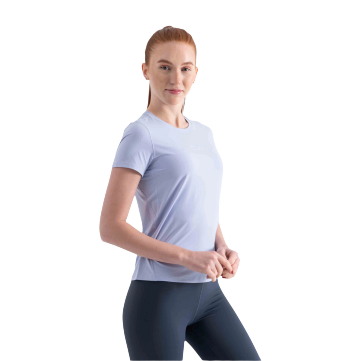 FRG SS TEE in light blue worn by a woman with red hair, featuring a crew neck and short sleeves for activewear.