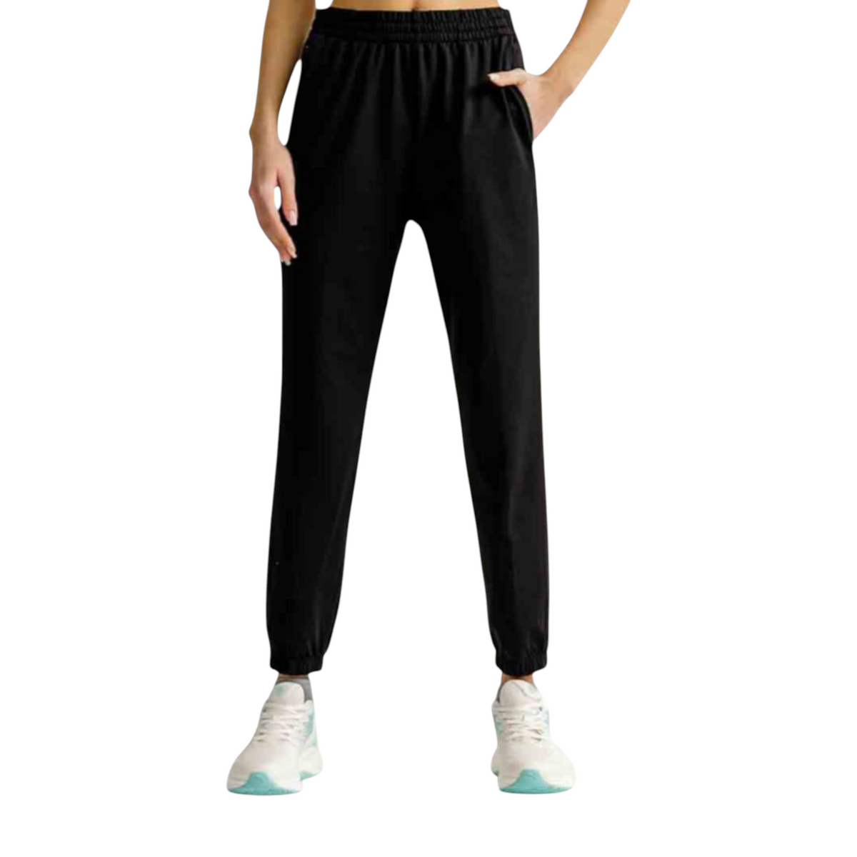 FRG black knit track pants with an elastic waistband and cuffed ankles worn by a model with white sneakers