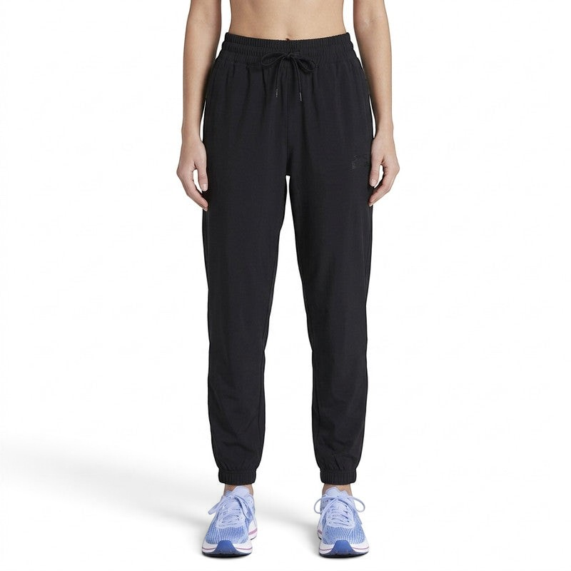 FRG ANTA black knit ankle pants with a drawstring waist and elastic cuffs worn by a model for athletic training