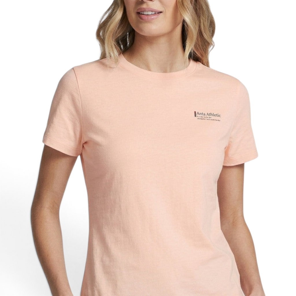 FRG ANTA soft pink short sleeve cross training t-shirt with crew neck and small chest logo on a female model