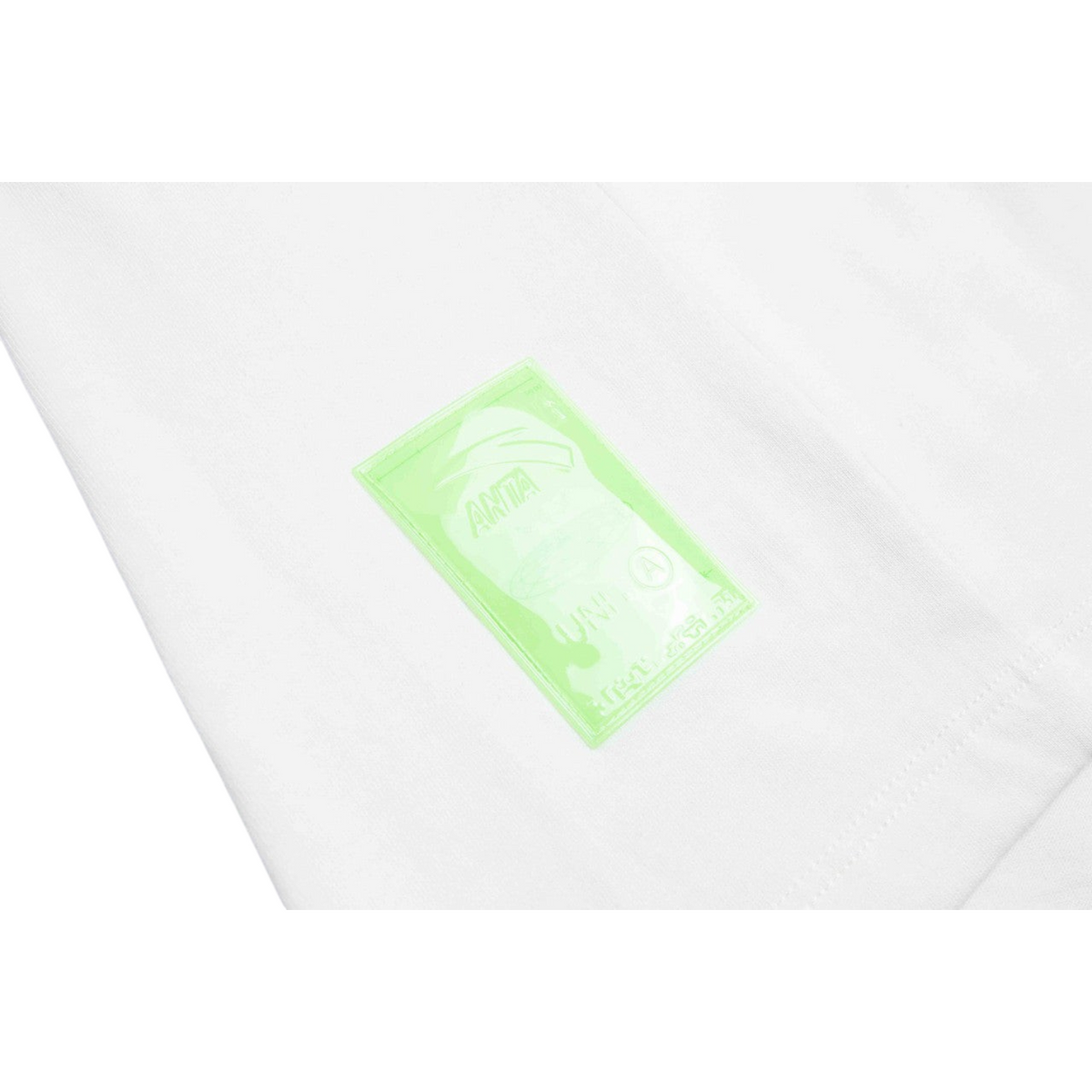 FRG ANTA beige cross training t-shirt featuring a translucent neon green logo patch on the fabric