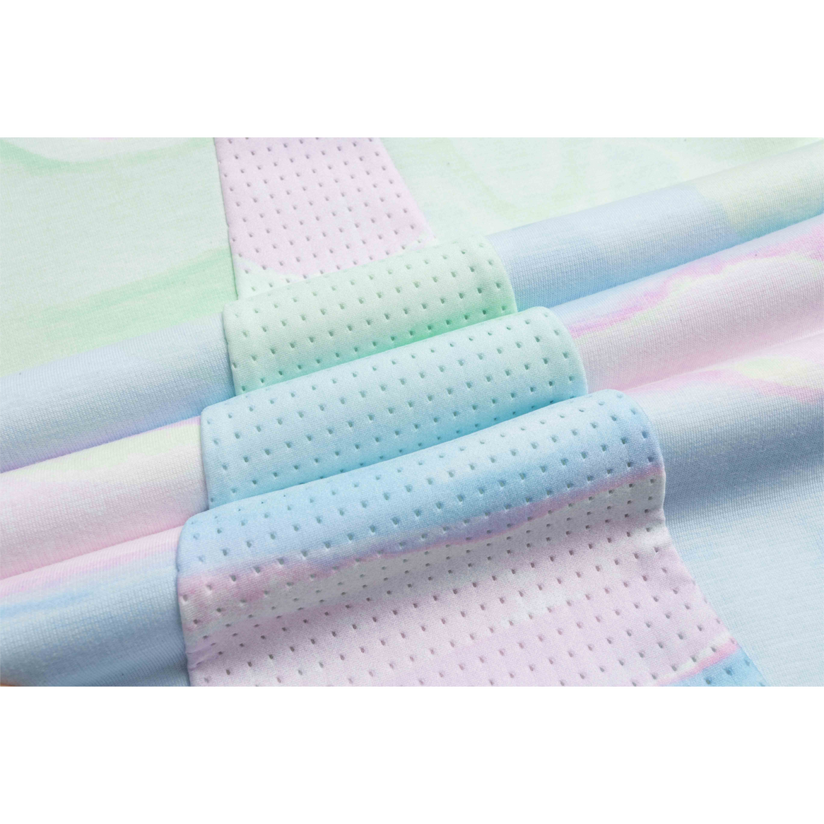 FRG SS TEE featuring a pastel tie-dye pattern with perforated breathable fabric panels in a soft layered design.
