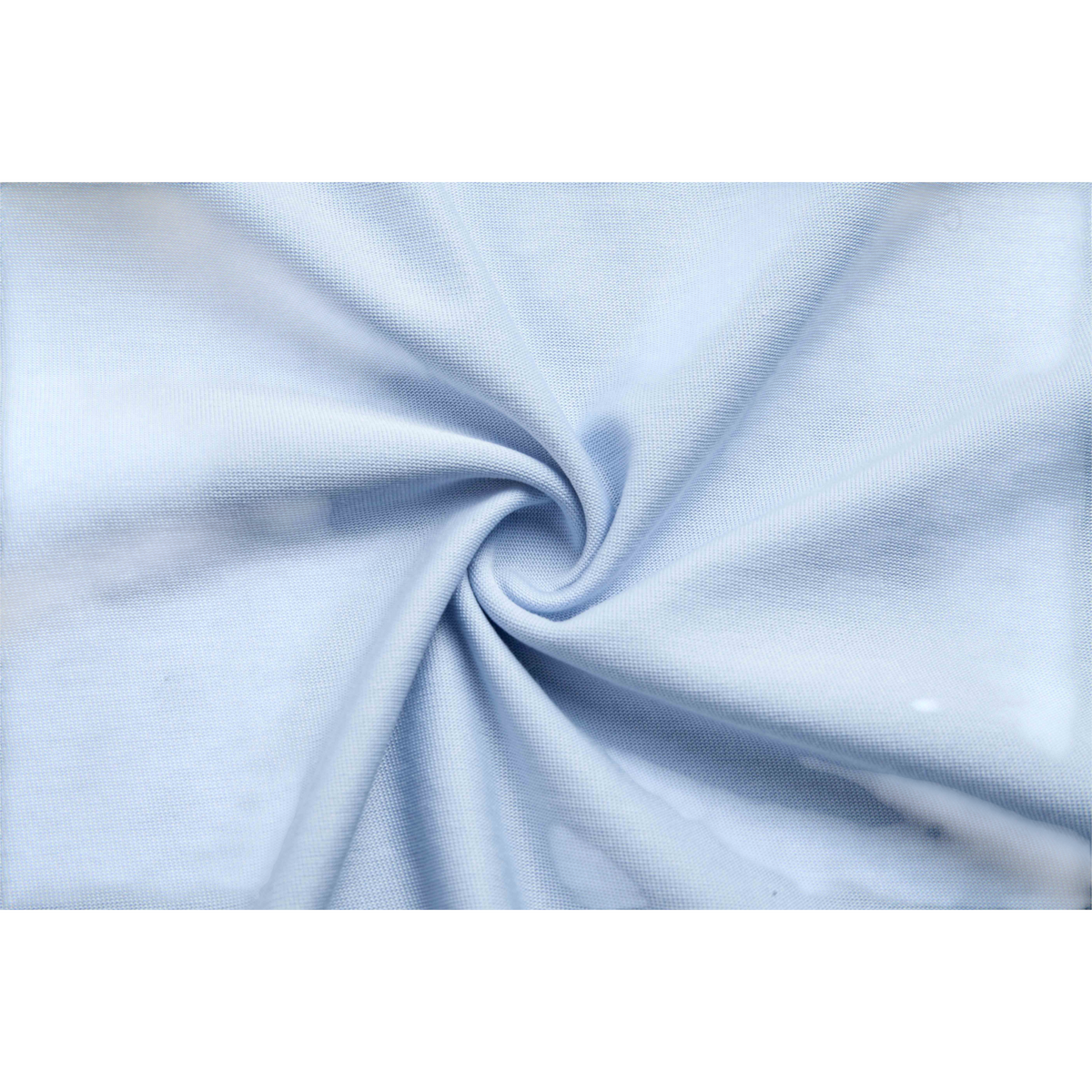 Close-up of light blue fabric texture from a FRG SS TEE showing the smooth knit material and soft folds.