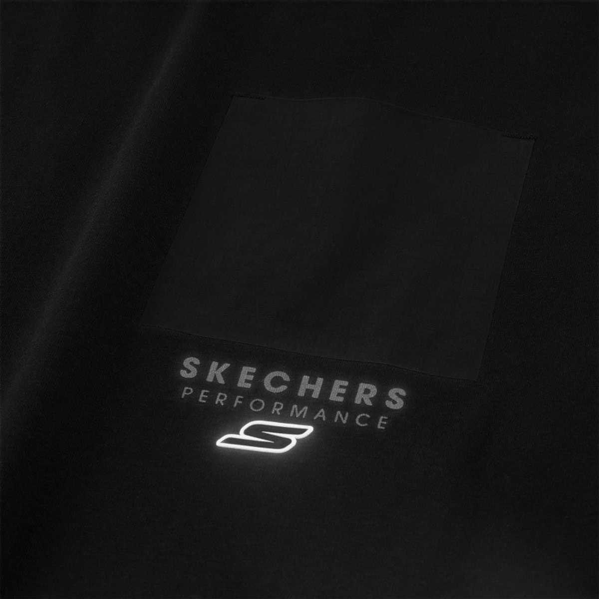 FRG black performance top featuring a chest pocket with Skechers Performance logo and reflective branding detail