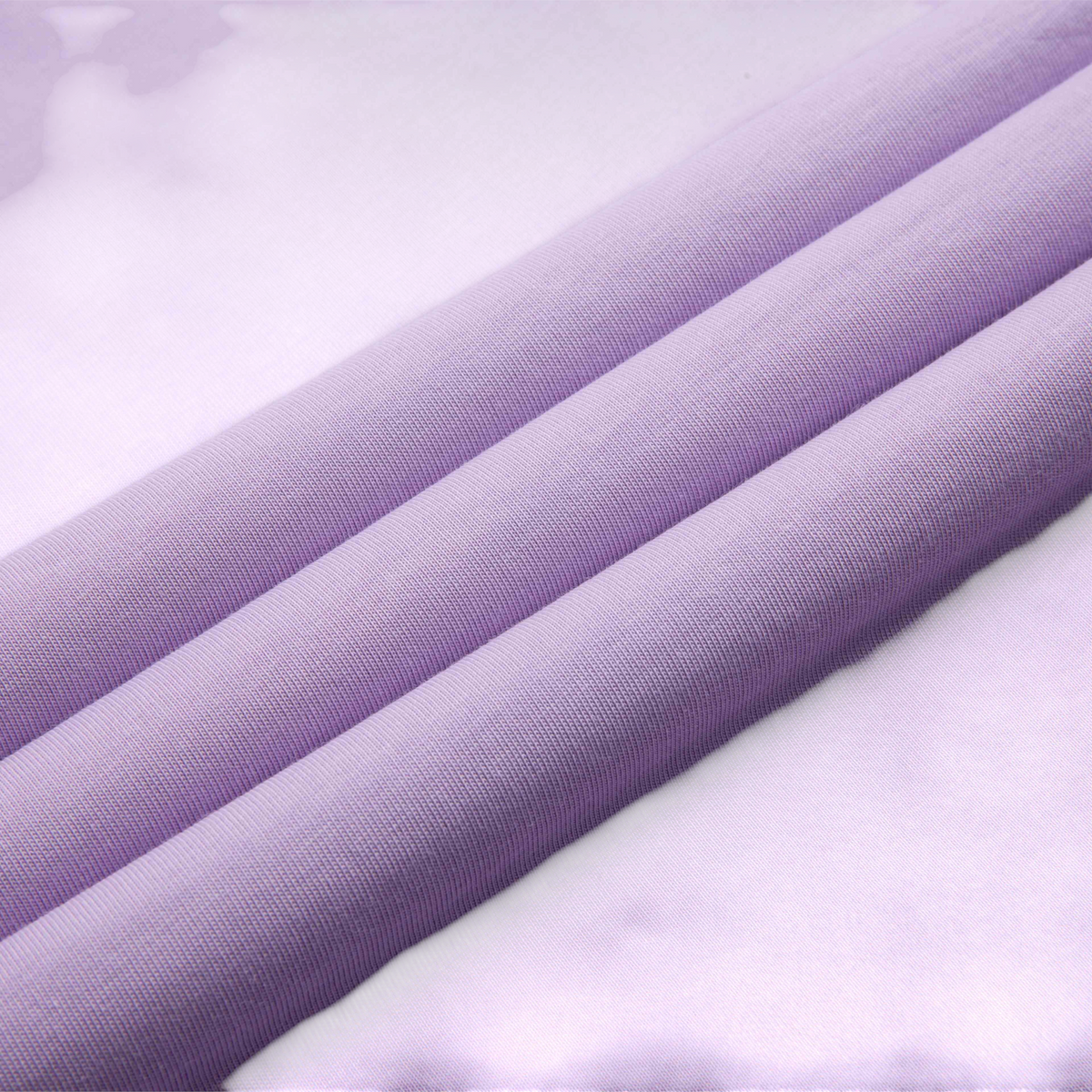 FRG SS TEE in a soft lavender purple cotton fabric with a smooth texture and subtle folds
