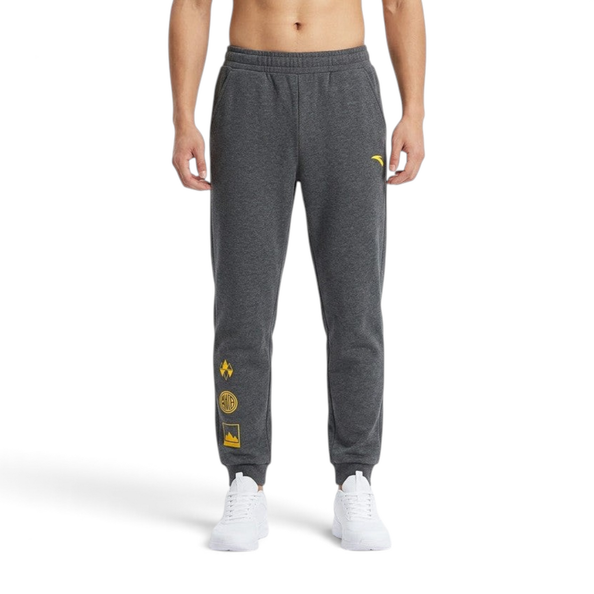 FRG ANTA outdoor knit track pants in heather grey with yellow graphic details and elastic cuffs on a model