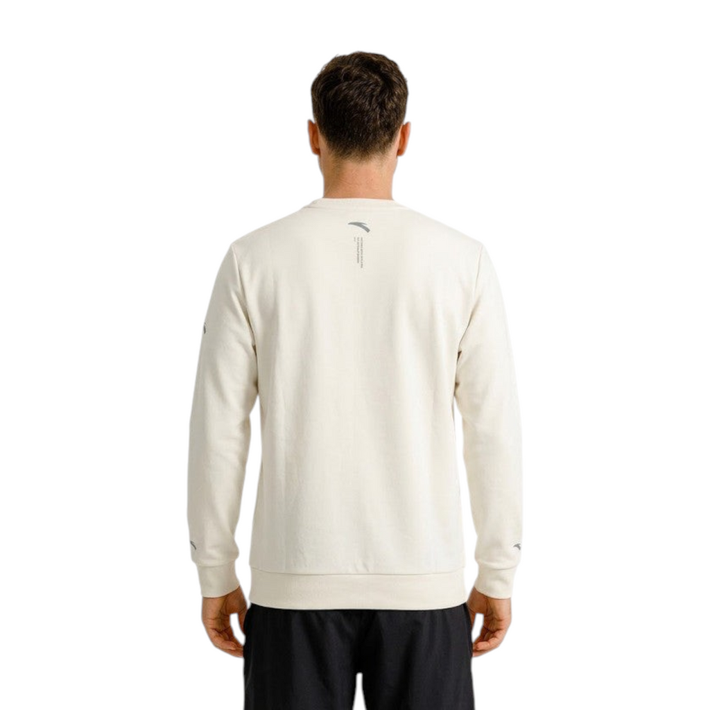 Back view of a man wearing a grey FRG ANTA Light Travel sweatshirt with ribbed cuffs and hem.