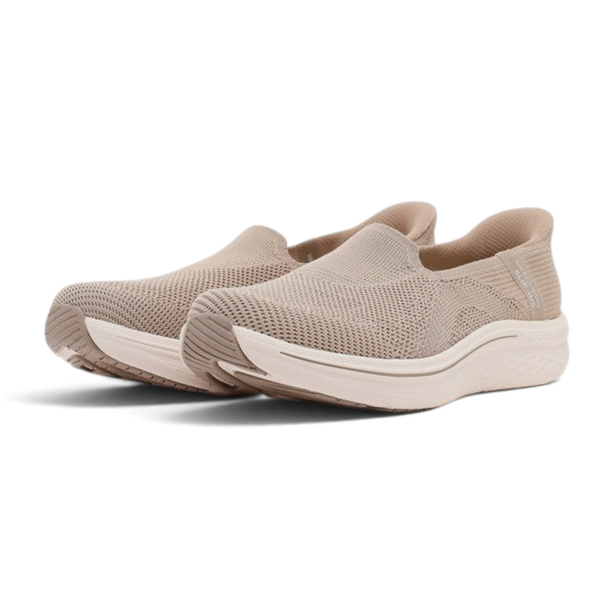 FRG Skechers Max Cushioning Lite Aura Tessa taupe slip-on sneakers with engineered knit upper and cushioned midsole.